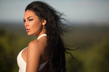 Fototapeta premium beautiful young female in white tracksuit in summer