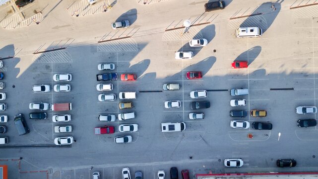 Aerial View Of  Park Station And Parked Vehicles. Shopping Mall Parking Lot.