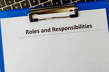 Roles and responsibilities document in the tablet at the laptop on the table