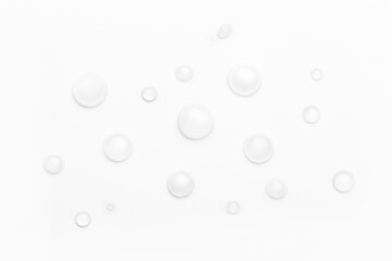 drops of water on a white background, top view