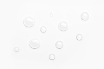 drops of water on a white background, top view