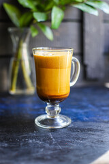 latte or cappuccino dalgona coffee in a transparent glass sweet hot drink cocoa with milk organic eating healthy top view place for text copy space