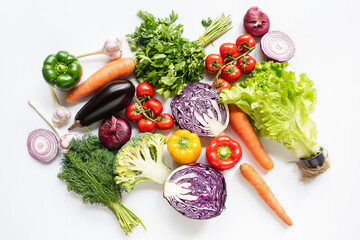 top view of colorful assorted fresh vegetables on white background