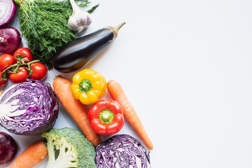 top view of colorful assorted fresh vegetables on white background