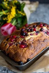 Fototapeta na wymiar Loaf cake with red berries on the table