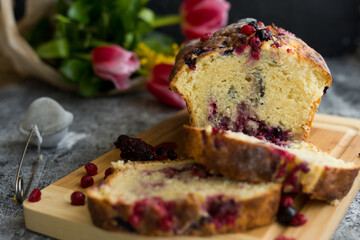 Loaf cake with red berries on the table