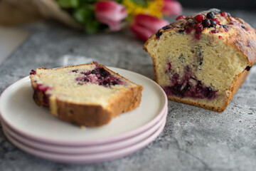 Loaf cake with red berries on the table