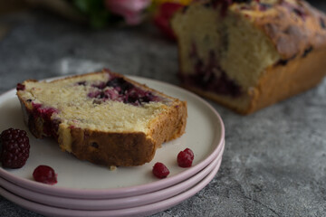 Loaf cake with red berries on the table