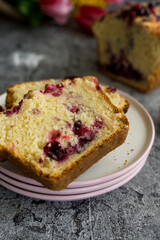Loaf cake with red berries on the table