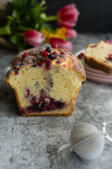 Loaf cake with red berries on the table