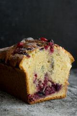 Loaf cake with red berries on the table
