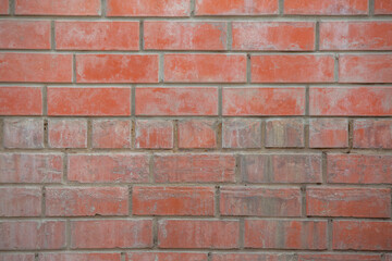 The wall of the building is made of old white brick. Background for text, posters. The brick is destroyed, the brick crumbles. Lots of bricks in the background.