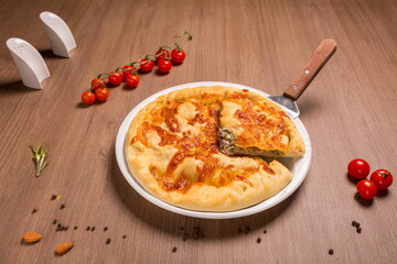 Khachapuri with meat and cilantro beef, sulguni, onion