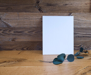 White frame on wooden wall background, mock up