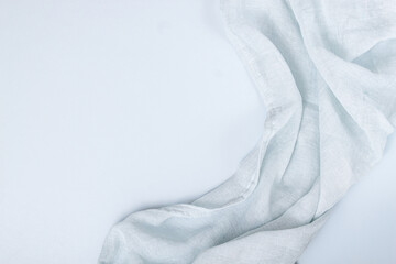 Grey cotton napkin on stone table.