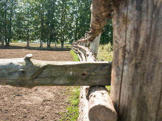 a fence made of logs. Cattle fence