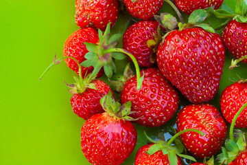 Fresh ripe juicy strawberries on the orange plate