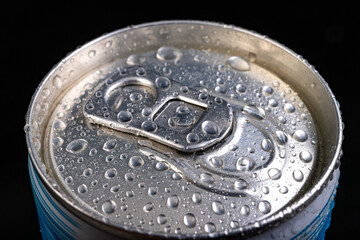 Wet pin on the can. A refreshing drink closed in a metal container.