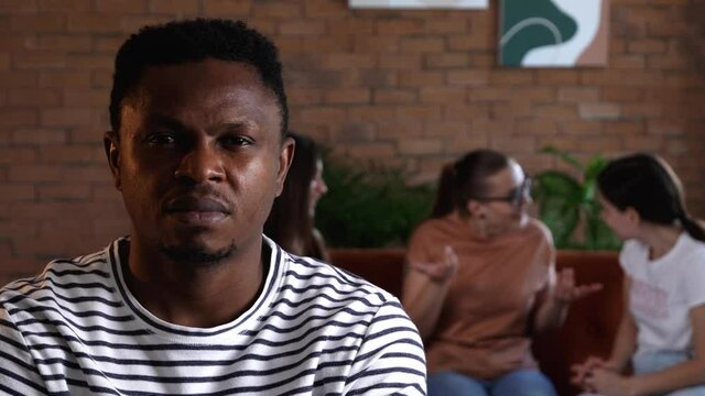 People ignoring African-American man. Stop racism