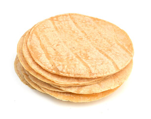 A stack of corn tortillas on a white background