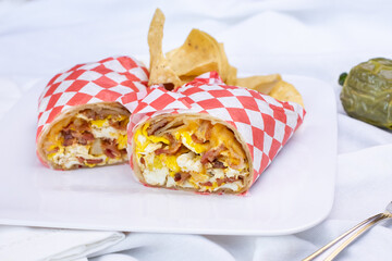A view of a breakfast burrito, in a restaurant or kitchen setting.