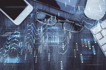 Multi exposure of forex graph hologram over desktop with phone. Top view. Mobile trade platform concept.