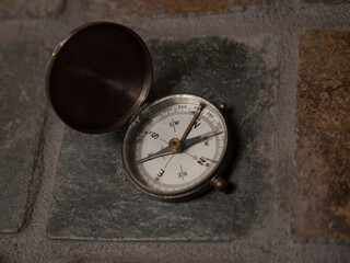 Vintage compass on a stone counter