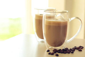 Tasty coffee with lavender on light background