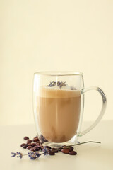 Tasty coffee with lavender on light background