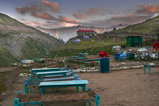Closeup shot of tourists sitting area behind Naran kaghan saif ul malook lake in Pakistan