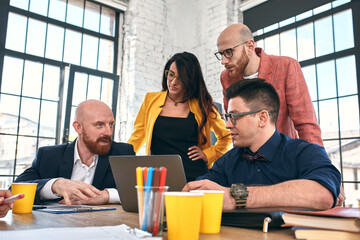 Business meeting in an office, the businesspeople are discussing a document
