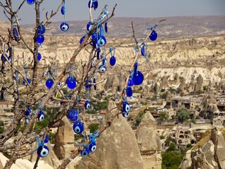 TURKEY AMULETS AGAINST THE EVIL EYE ON TREE.