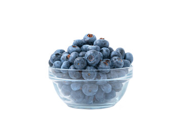 Close up of bowl full of blueberries isolated on white background. Ripe blueberry plate. Organic and healthy food.