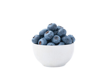 Close up of bowl full of blueberries isolated on white background. Ripe blueberry plate. Organic and healthy food.