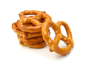 Salted pretzels on white background