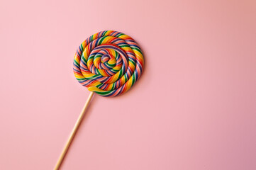 Swirl lollipop on a pink background.