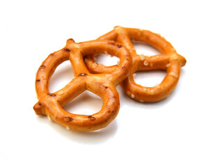 Salted pretzels on white background