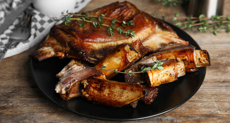 Delicious roasted ribs served on wooden table. Banner design