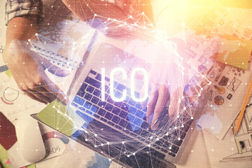 Double exposure of man and woman working together and crypto theme hologram drawing. Computer background. Blockchain concept. Top View.