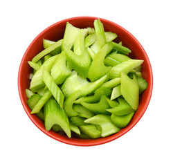 heap of sliced celery, isolated in red bowl on white background