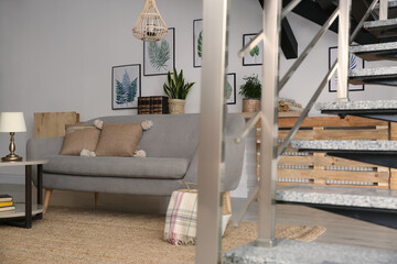 Modern comfortable sofa in stylish living room interior