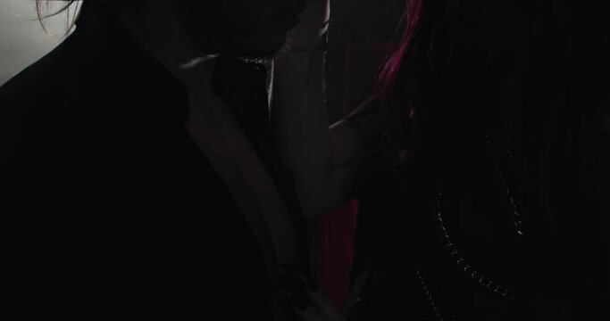 Female demon, succubus is seducing a man, touching him, dark room, 4k