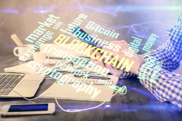 Double exposure of man's hands holding and using a phone and crypto currency blockchain theme drawing.