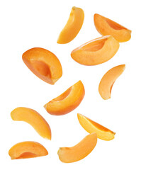 Ripe apricot slices falling on white background