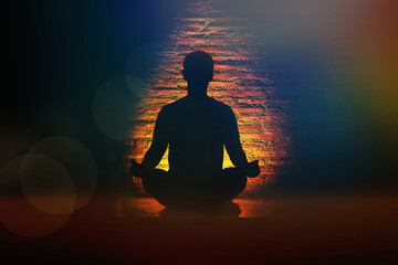 Meditating human in lotus pose. Yoga illustration.Shining aura cover human body chakras and aura glow in darkness space.