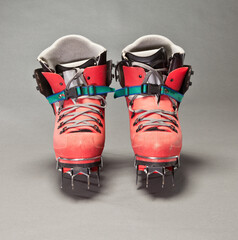 Red ice climbing boots shot in studio.