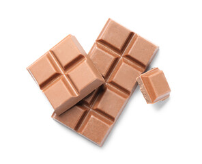 Pieces of delicious milk chocolate isolated on white, top view