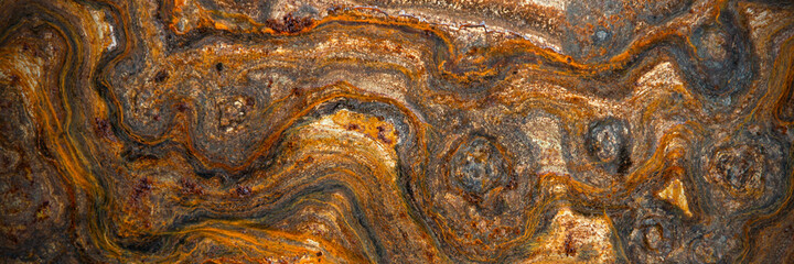 metal surface with curly rust, stains of different degrees of oxidation