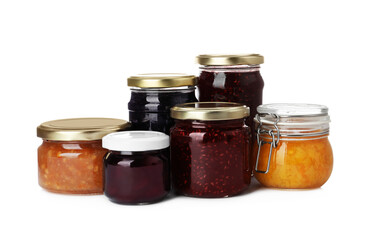 Jars with different jams on white background