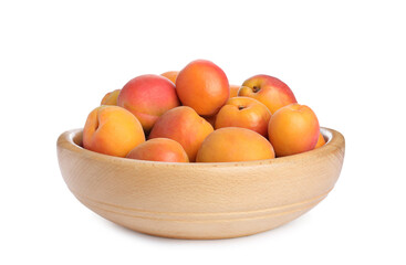 Delicious ripe apricots in wooden bowl isolated on white